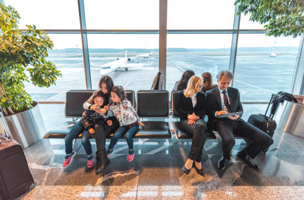 istock Passengers waiting at airport departure area 1010631792