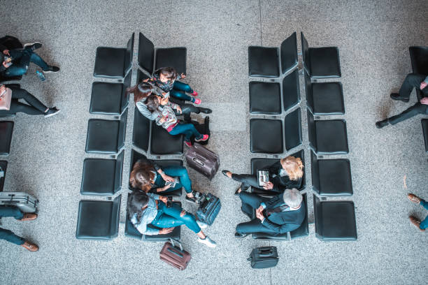 istock Passengers waiting for flights at departure area 1010631834