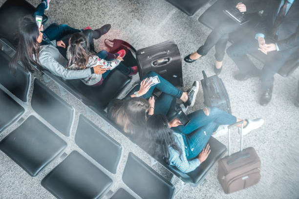 istock Passengers sitting on seats in departure area 1010631952