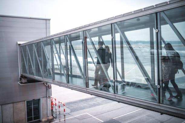 istock Passengers walking on footbridge at airport 1010635228