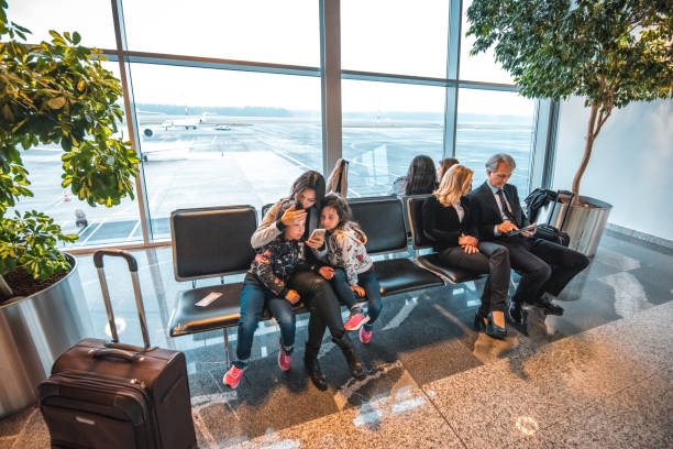 istock Passengers waiting at airport departure area 1010636418