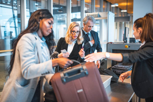 istock Passengers standing by security scanner at airport 1010636720