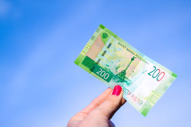 istock Banknote Two hundred russian rubles on blue sky background 1010637420
