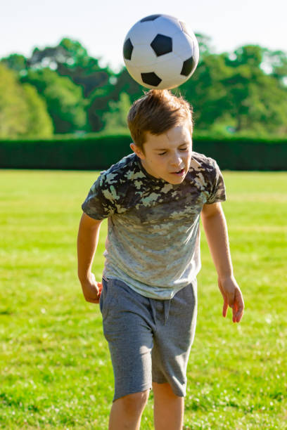 istock Pre-teen caucasian boy playing outside 1010637574