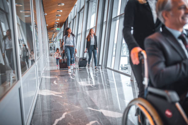 istock Passengers on corridor at airport terminal 1010638722