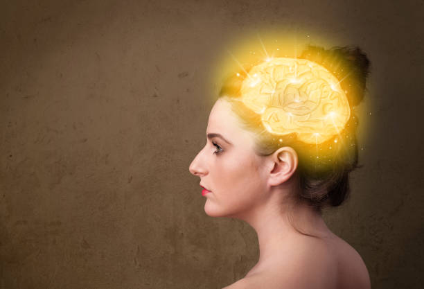 istock Young girl thinking with glowing brain illustration 1010640956