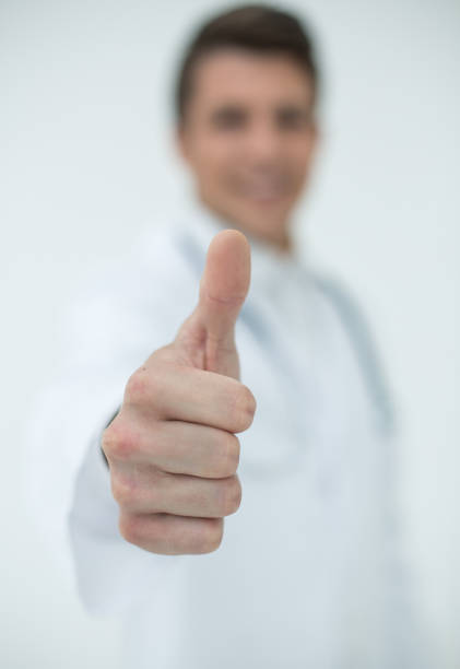 istock background image.a successful doctor showing thumbs up 1010640960