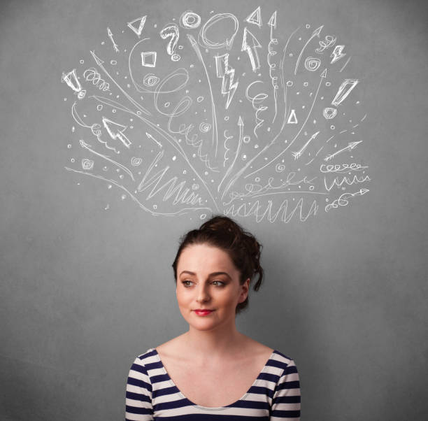 istock Young woman thinking with sketched arrows above her head 1010641030