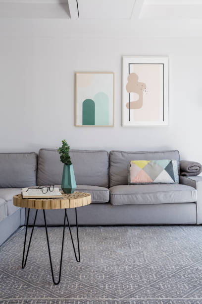 istock Plant on table on grey carpet in living room interior with poste 1010647314