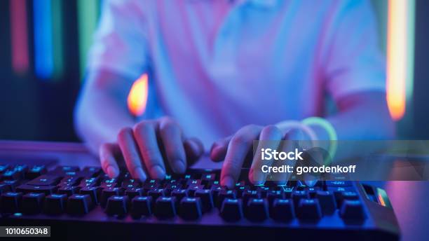 Closeup On The Hands Of The Gamer Playing In The Video Game Using Keyboard Hacker Breaks Into System Stock Photo - Download Image Now