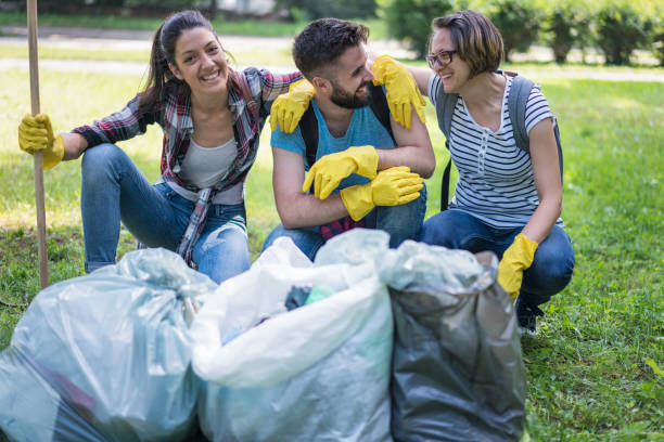 istock Happy young people doing community work in the local park 1010655474