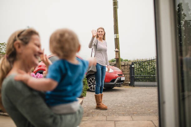 Waving Goodbye To Her Mother And Son