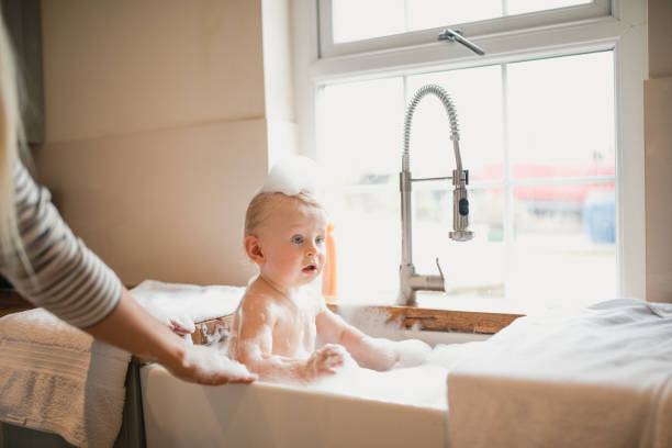 istock Baby Boy Has A Bubble Bath In The Sink 1010660222