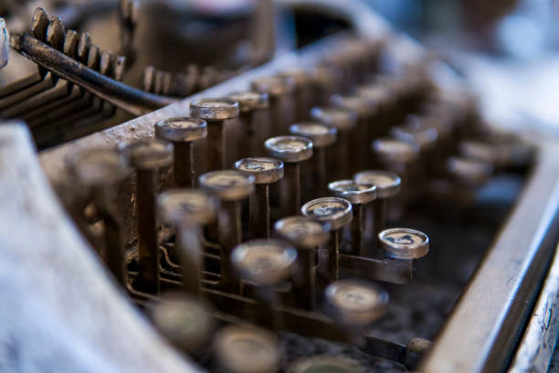 istock Close up view on an old dirty broken antique typewriter machine keys with Cyrillic symbols letters. 1010660364