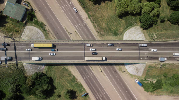 istock Top down aerial view of transportation highway overpass 1010665034