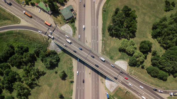 istock Top down aerial view of transportation highway overpass 1010665208