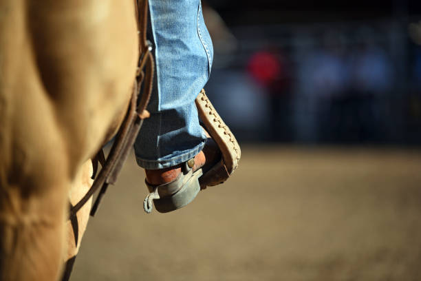 Stirrup with cowboy boot stock photo