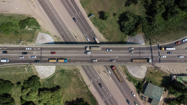 istock Top down aerial view of transportation highway overpass 1010665588