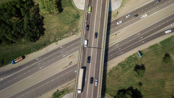 istock Top down aerial view of transportation highway overpass 1010665854