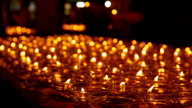 istock Burning candles and black background 1010668600