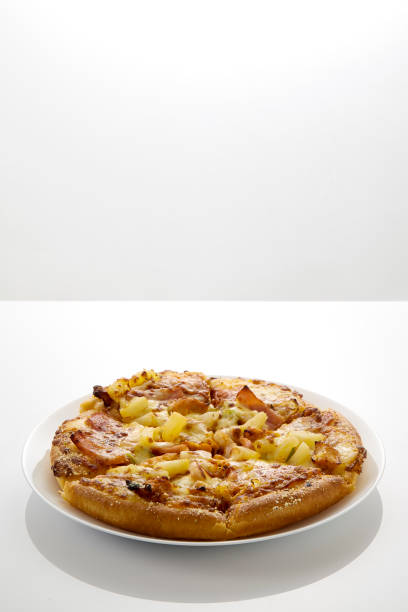 istock Whole Hawaiian pizza with pineapple and ham 1010668854