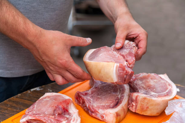 istock Close-up of a man  cook pork 1010674424
