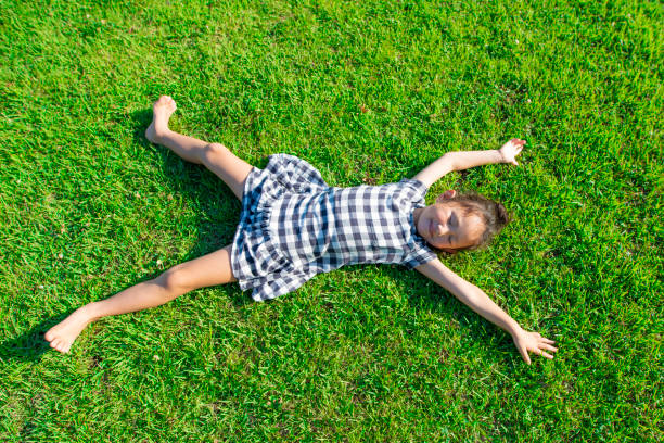 istock Girl lie down on the lawn 1010674770