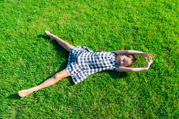 istock Girl lie down on the lawn 1010674776