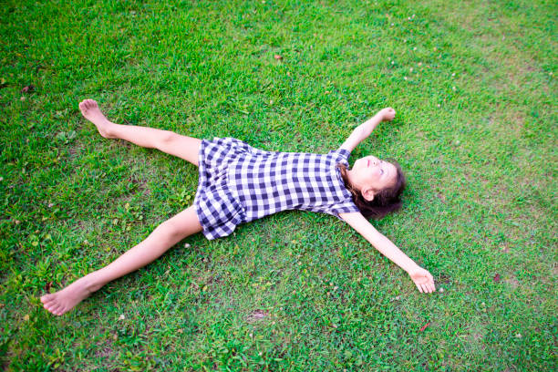 istock Girl lie down on the lawn 1010674794