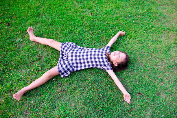 istock Girl lie down on the lawn 1010674838