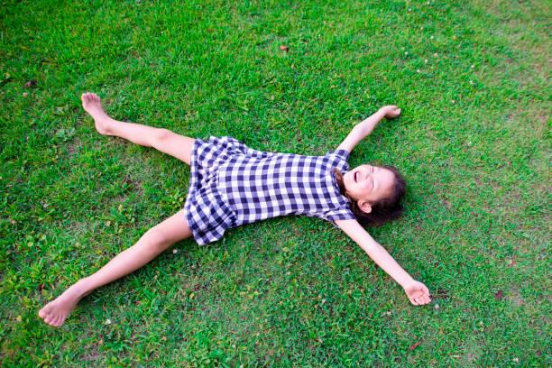 istock Girl lie down on the lawn 1010674844