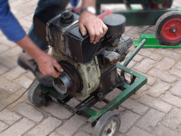 istock View Of Hand Starting Old Machine With Starter Rope 1010675508