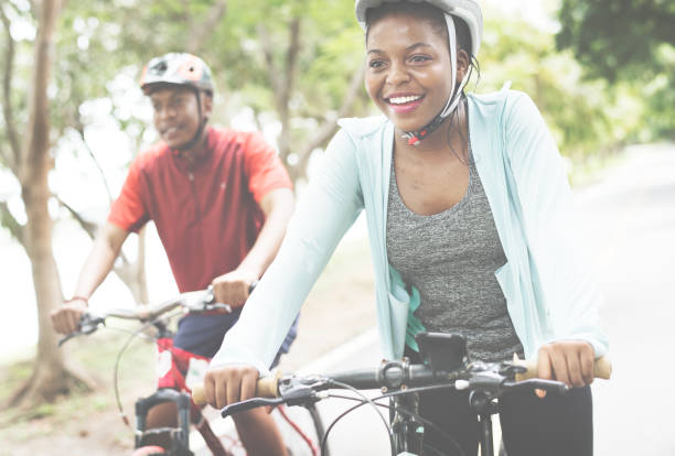 istock Cyclist couple riding together in a park 1010681456