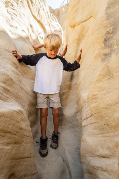 istock Boy Hiking Through A Canyon 1010687024
