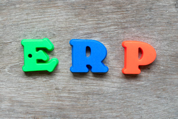 istock Colorful plastic alphabet in word  ERP (Abbreviation of Enterprise Resource Planning) on wood background 1010687388