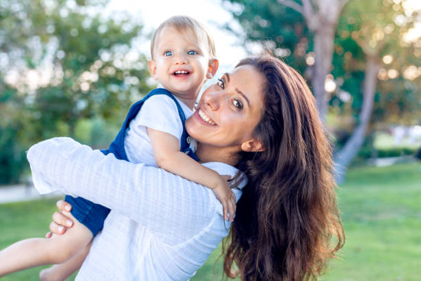 istock Mother with baby in the park 1010724080