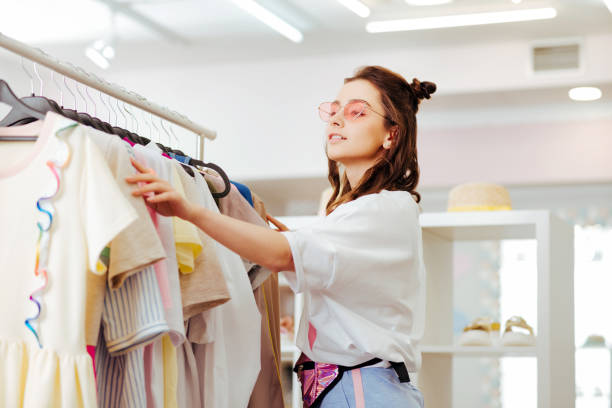 istock Modern woman with nice hairstyle looking for new outfit 1010724656