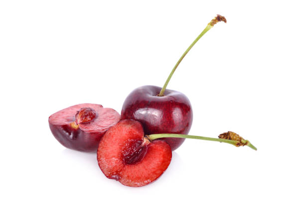 istock whole and half cut fresh cherry with stem on white background 1010739802