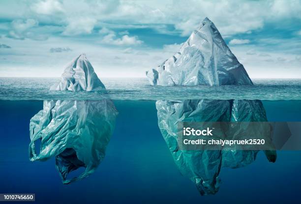 Plastic Bag Environment Pollution With Iceberg Of Trash Stock Photo - Download Image Now
