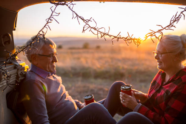 istock Senior couple outdoors with car 1010755714