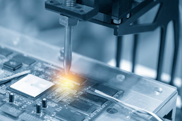 istock The soldering robot welding the circuit board 1010755766