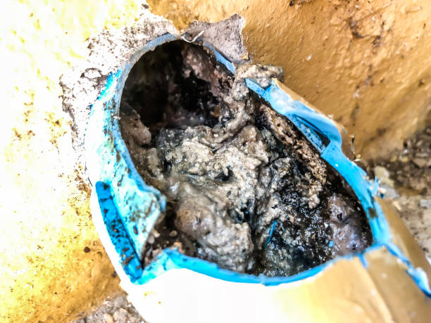 pvc sewer full of garbage , dirty limestone
