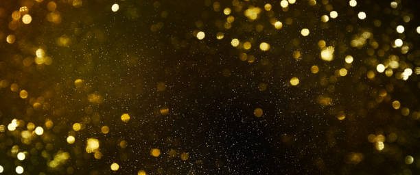 istock Christmas Gold light background.  Holiday glowing backdrop. Defocused Background With Blinking Stars. Blurred Bokeh. 1010758598