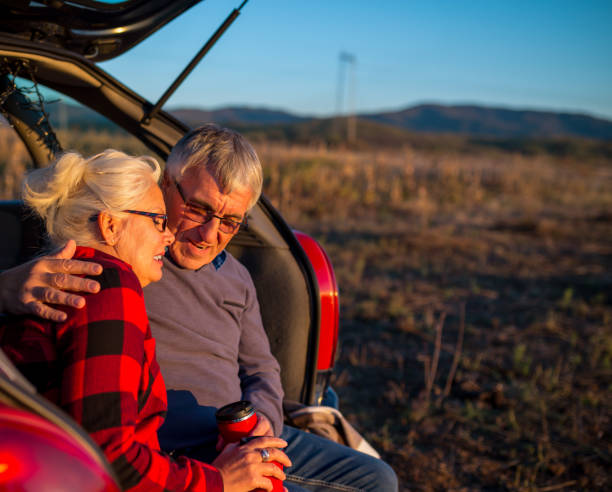 istock Senior couple outdoors with car 1010759276