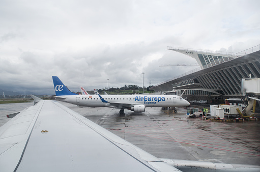 Air Europa airplane, being prepared to depart, at Bilbao airport, in Spain.