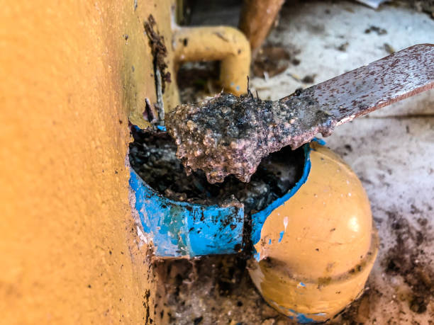 istock pvc sewer full of garbage , dirty limestone 1010760418
