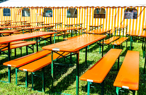 bavarian beergarden - table and benches at a tent