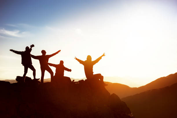 istock Happy friends at sunset mountains 1010770820