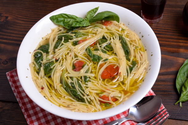 plate of soup with cherry tomatoes and pecorino - basil tomato soup food and drink imagens e fotografias de stock