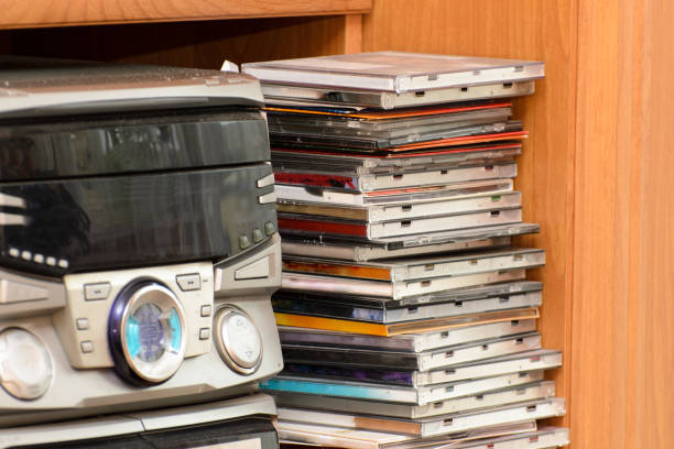 A HiFi tower with a collection of music on CD and DVD.